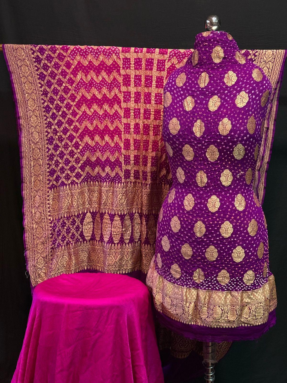 "Purple Banarasi unstitched suit set with golden zari and chevron-pallu dupatta displayed on mannequin"