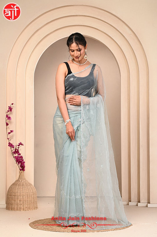 Light Firozi Tissue Organza Saree with Calcutta Work and Cut Dana Detailing