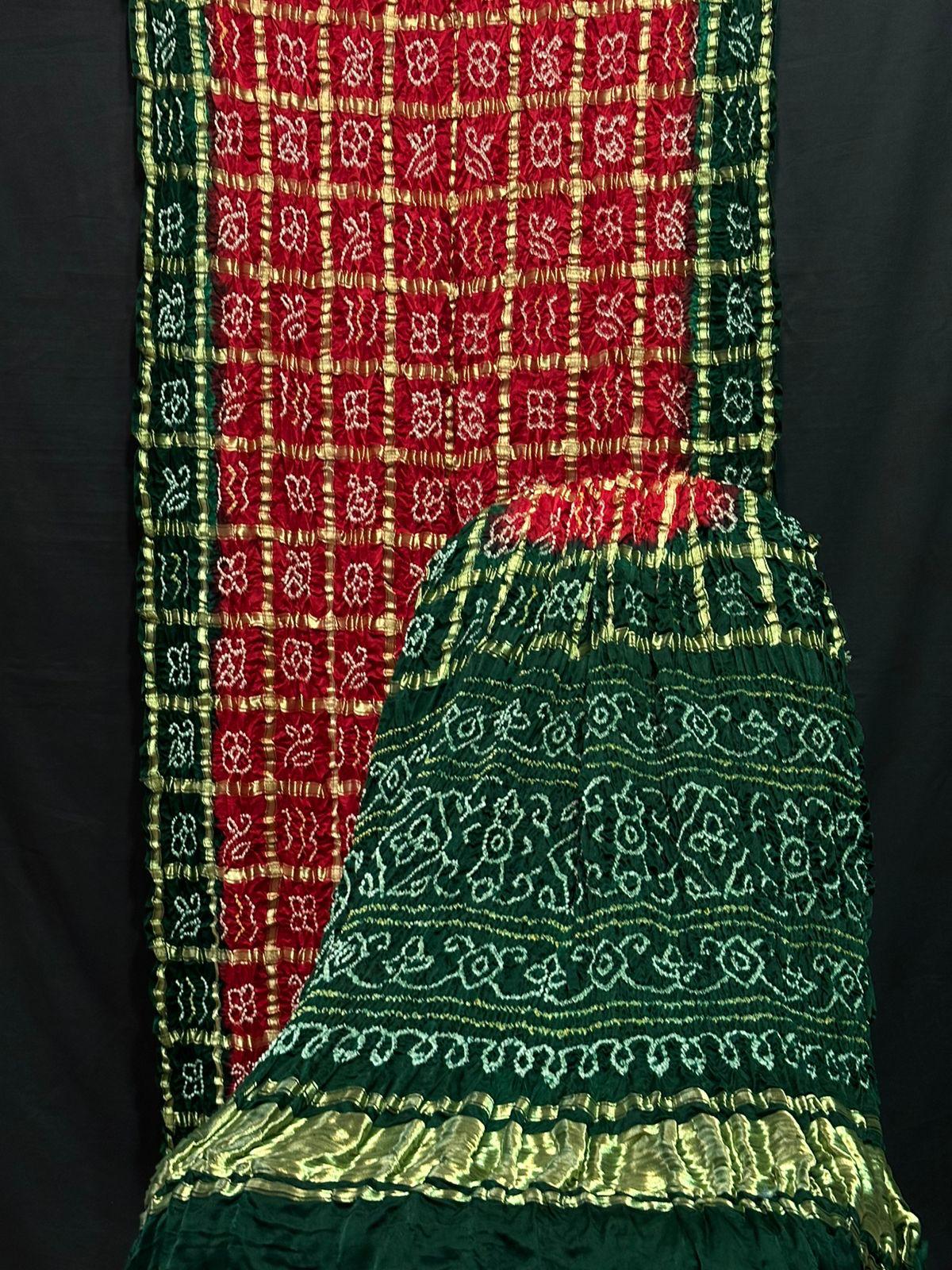 “Red and Green Bandhani Suit in Modaal Gajji Silk with golden Lagdi Patta dupatta – Anita Jain Fashions”