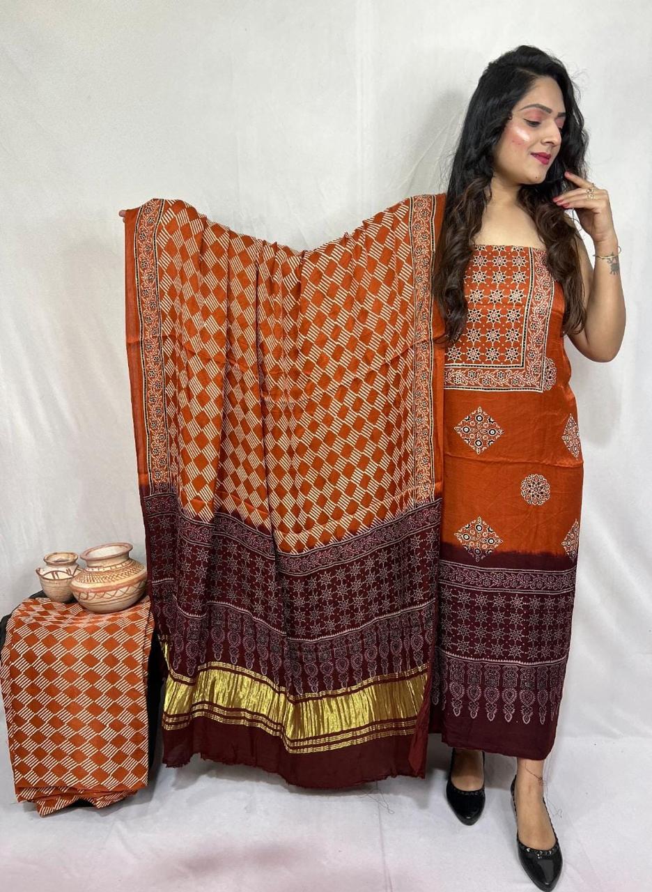 “Rust orange Bandhani suit set in Modaal Gajji Silk with hand-done maroon Lagdi Patta dupatta – Anita Jain Fashions”