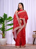 Red beaded saree with embroidered paisley motifs