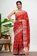 Red saree with ornate zari and sequin embroidery