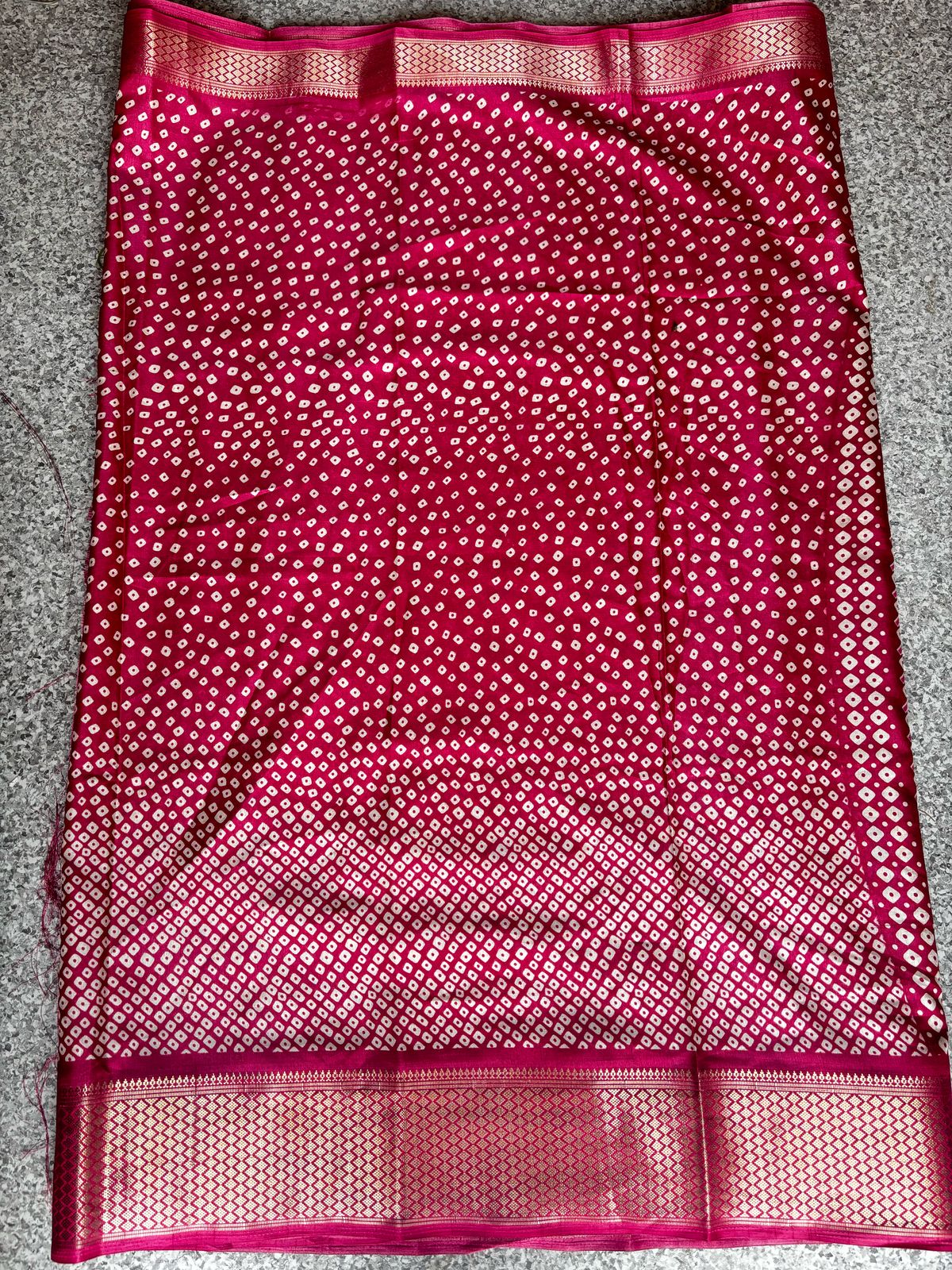 Rani Pink Fancy Silk Saree with Bandhani-Style Dotted Weave & Golden Border
