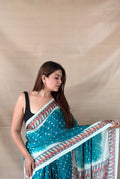 Printed saree with dot pattern and ornate border
