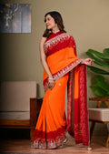 Red and orange saree with embroidered borders