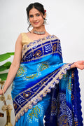 Navy and turquoise saree with geometric beadwork and gold zari