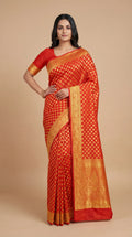 Orange Banarasi saree with gold weave