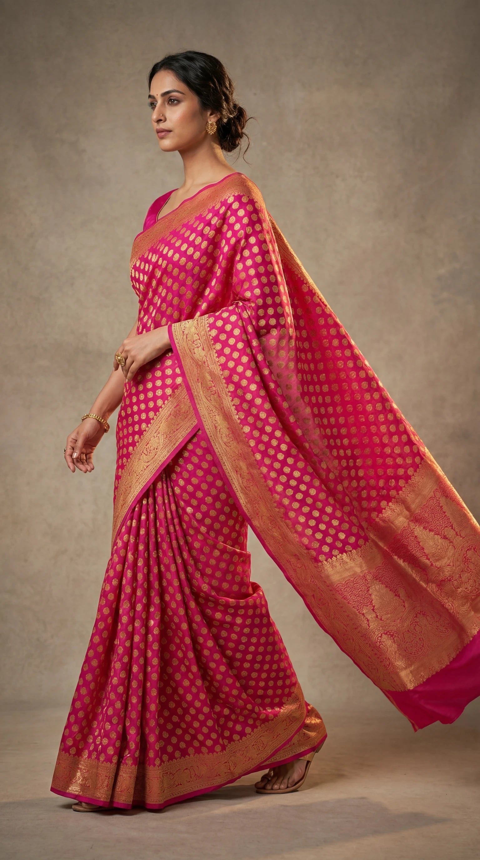Pink saree with golden zari motifs